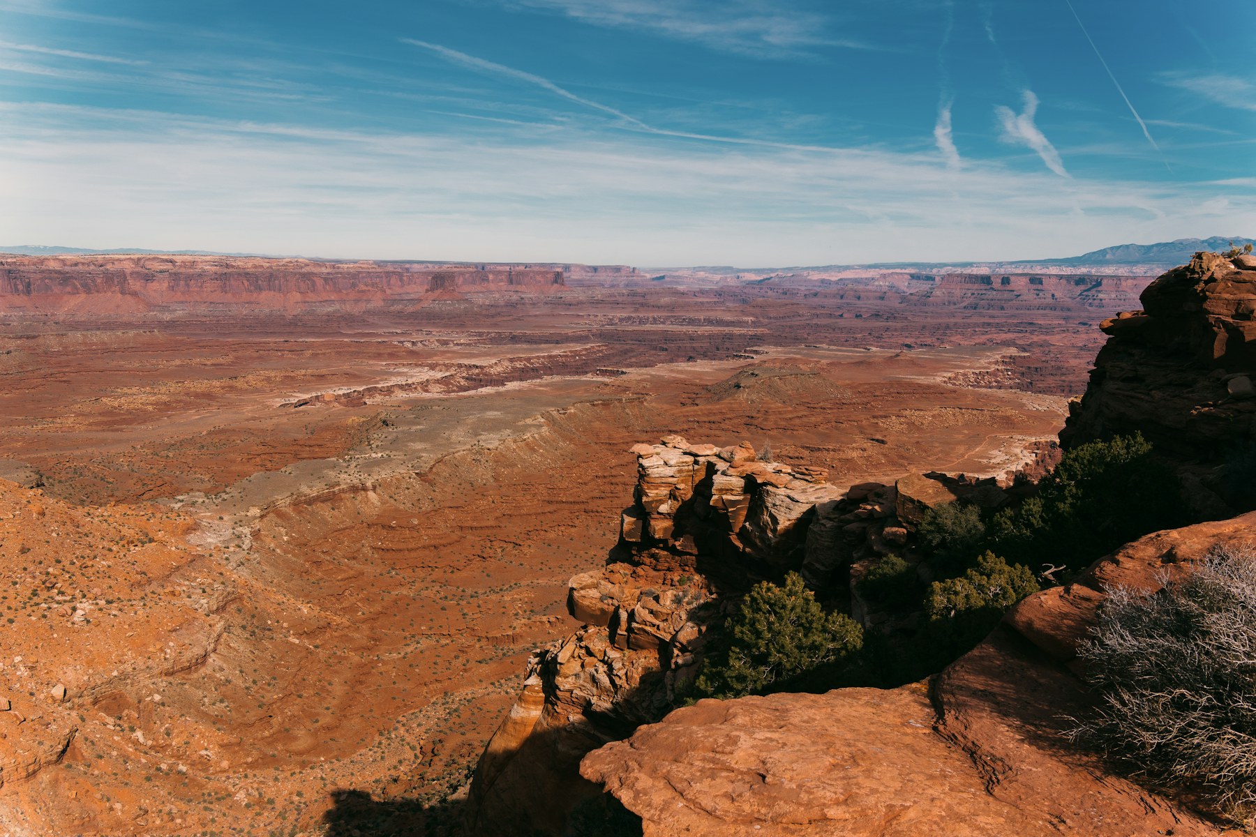 A vast Utah canyon beneath a clear blue sky